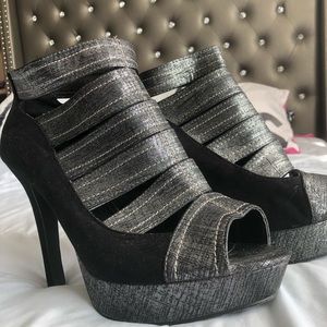 Gaze.   Black and silver heels